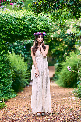 Buy stock photo Woman, flower and garden with fantasy, fairytale and eco fashion with confidence outdoor. Spring, park and elegance in forest and woods with beauty, natural and sustainable style on nature path