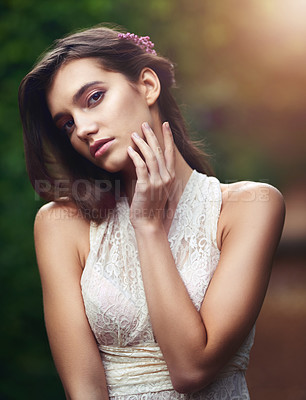 Buy stock photo Cropped shot of a beautiful young woman posing in nature