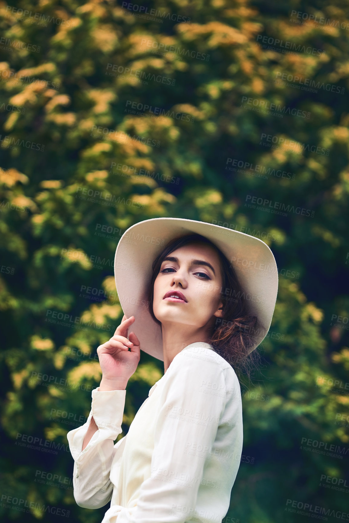 Buy stock photo Shot of a beautiful young woman spending a day in nature