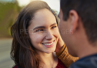 Buy stock photo Shot of a happy young couple spending a romantic day together outdoors