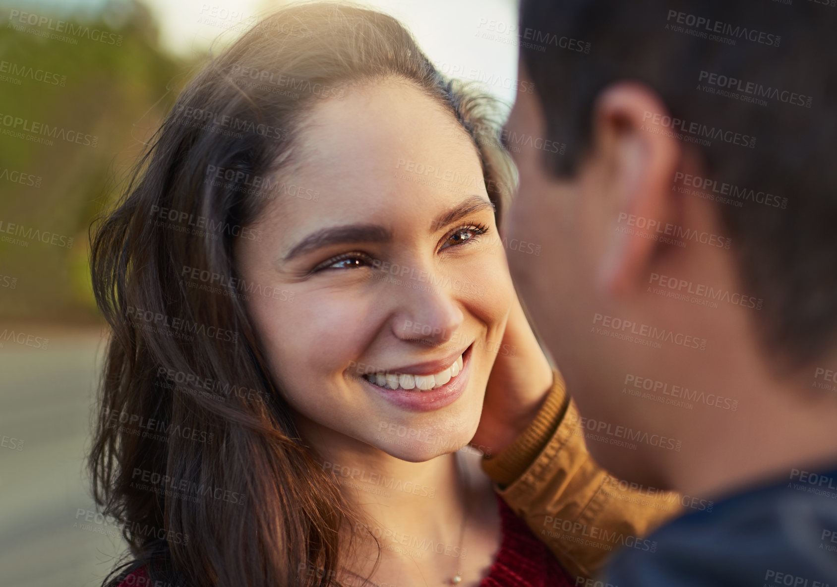 Buy stock photo Shot of a happy young couple spending a romantic day together outdoors