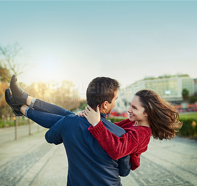 Buy stock photo Couple, happy and carry outdoor for travel, relationship and holiday with smile, embrace and support. People, connection and love together for freedom, bonding and adventure on weekend with vacation