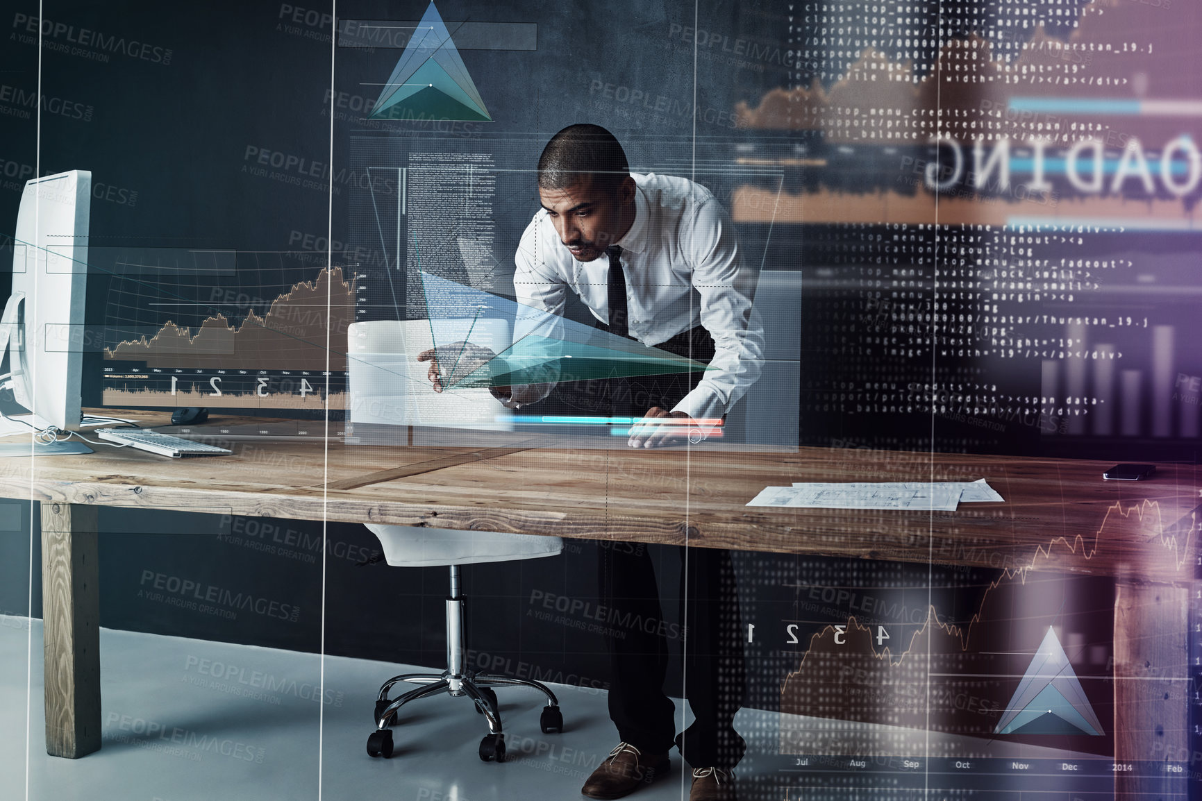 Buy stock photo Shot of a handsome young businessman using a digital interface