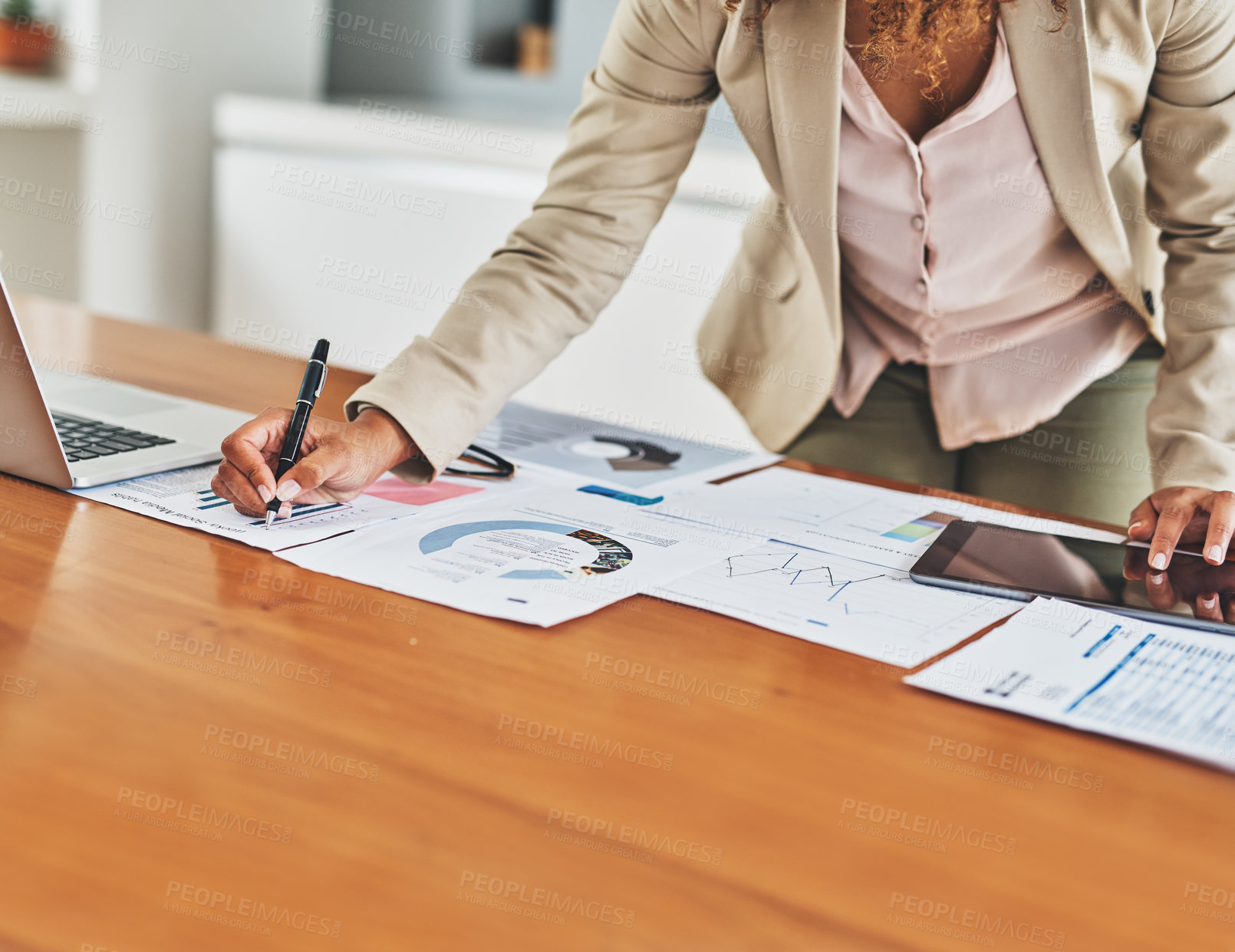 Buy stock photo Cropped shot of an unrecognizable businesswoman working in her office at home