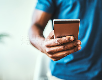 Buy stock photo Closeup shot of an unrecognizable man using a cellphone