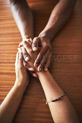 Buy stock photo High angle shot of two unrecognizable people holding hands