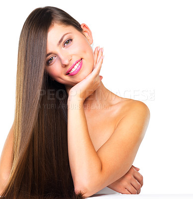 Buy stock photo Studio portrait of a beautiful young woman posing against a white background