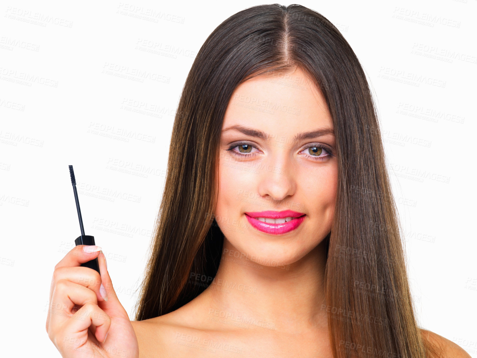 Buy stock photo Studio portrait of a beautiful young woman holding a mascara wand against a white background