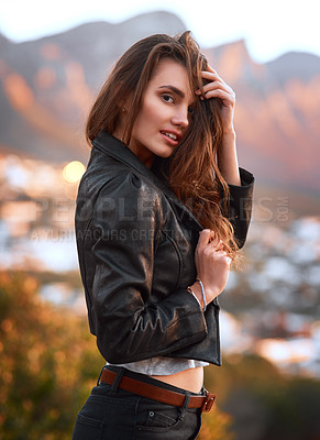 Buy stock photo Portrait of an attractive and stylish young woman spending some time outdoors