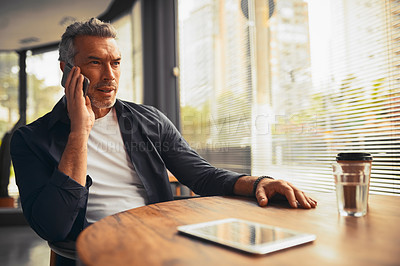 Buy stock photo Cropped shot of a mature businessman on a call in the office