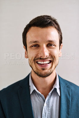 Buy stock photo Portrait of a handsome young businessman standing in an office