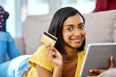 Buy stock photo Shot of a teenage girl using a tablet and credit card at home