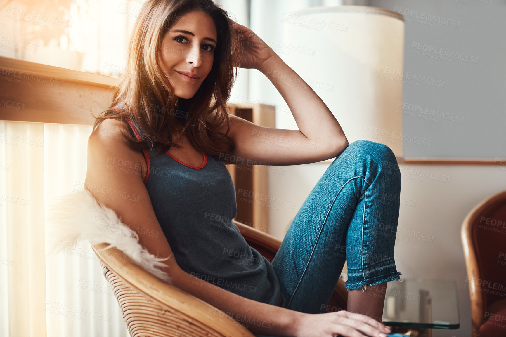 Buy stock photo Portrait of an attractive young woman relaxing at home