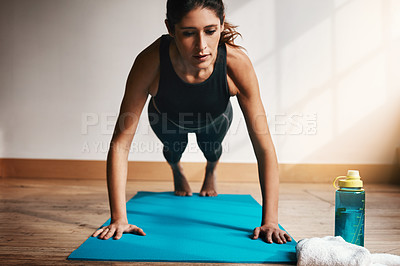 Buy stock photo Shot of an attractive young doing pushups at home