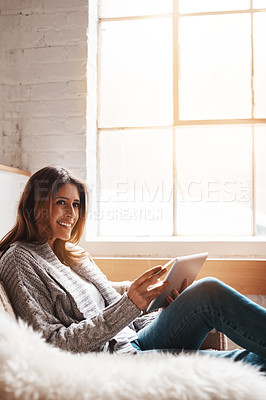 Buy stock photo Thinking, tablet and bank payment with a woman online shopping on a sofa in the living room of her home. Ecommerce, financial and fintech banking with a young female online customer in her house