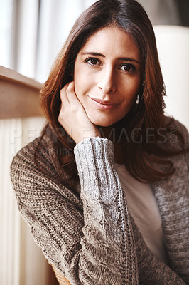 Buy stock photo Portrait of an attractive young woman relaxing on a chair at home