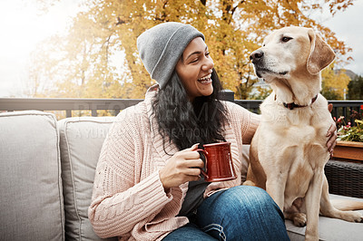 Buy stock photo Home, woman and happy with dog on sofa in balcony for friendship, bonding and trust with care and support. Female person, animal and pet owner with coffee for fun, relax and welfare and adoption