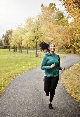 Buy stock photo Portrait of an attractive young woman going for a run in nature