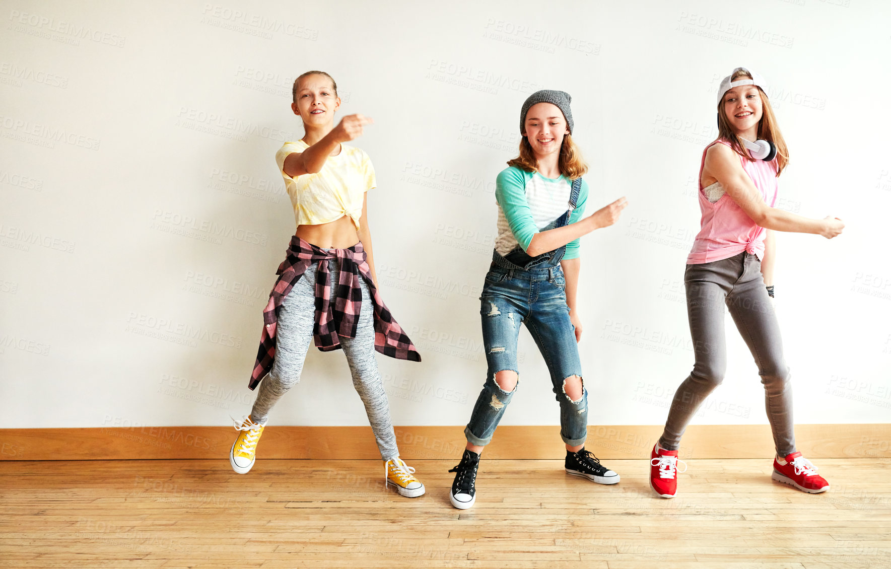 Buy stock photo Shot of young girls dancing in a dance studio