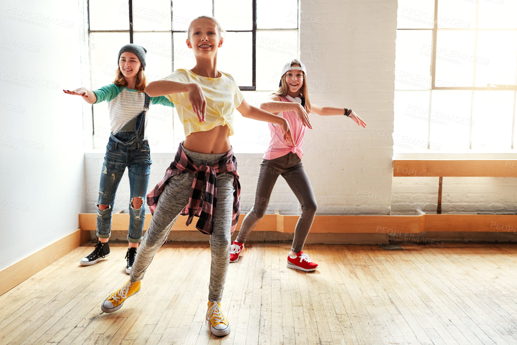 Buy stock photo Dance, girl group and children with routine, studio and rhythm for creative art performance or rehearsal. Smile, friends and happy kids in cool hip hop crew for practice, motion or learning in class 