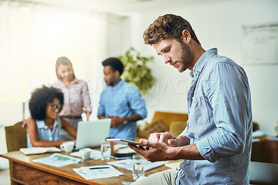 Buy stock photo Shot of young designers working in a modern office