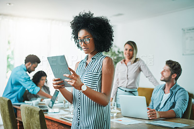 Buy stock photo Shot of young designers working in a modern office