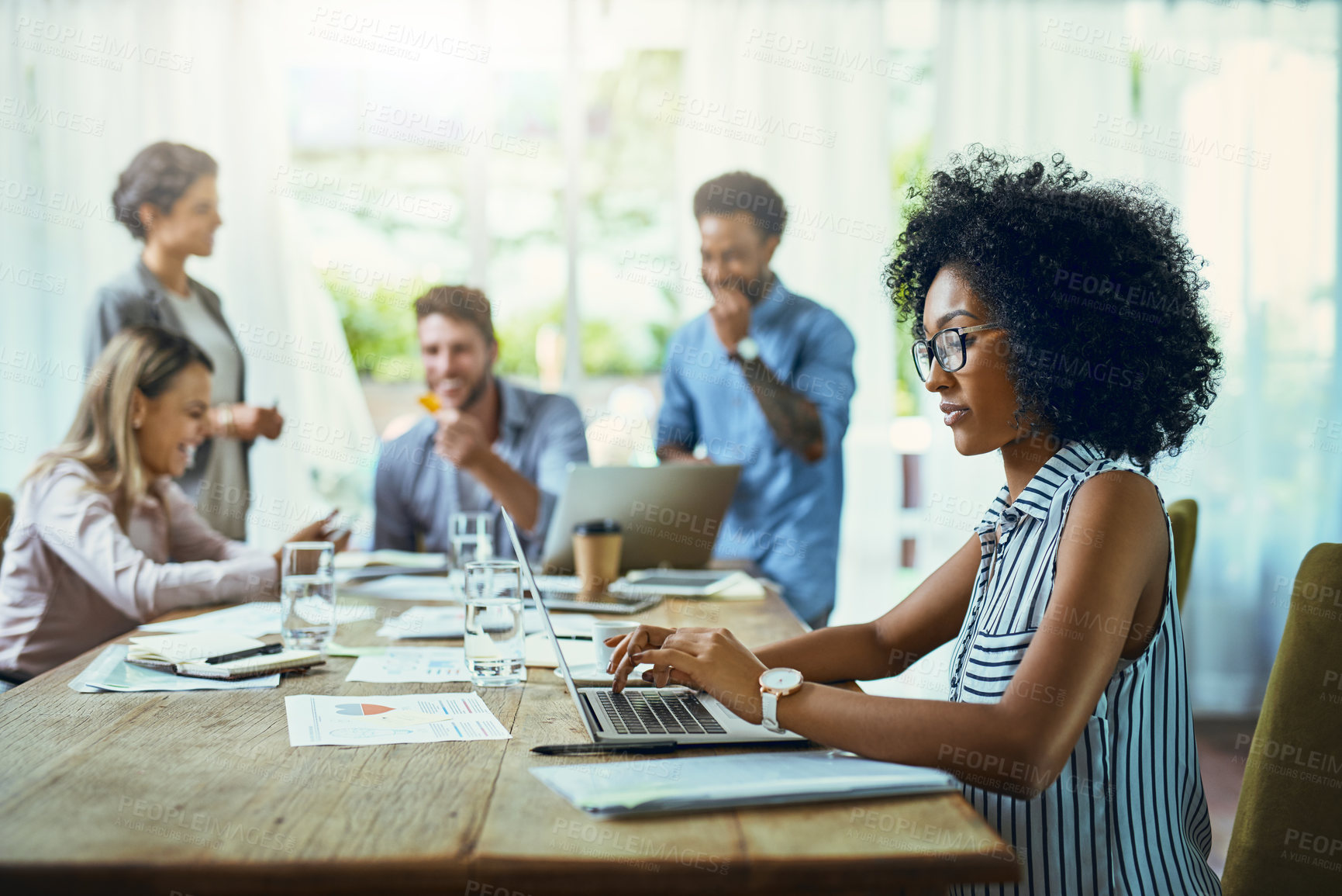 Buy stock photo Shot of young designers working in a modern office