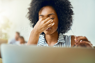 Buy stock photo Cropped shot of a young female designer experiencing a headache in a modern office