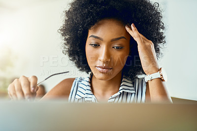 Buy stock photo Cropped shot of a young female designer experiencing a headache in a modern office