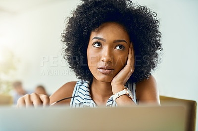 Buy stock photo Cropped shot of a young female designer working in a modern office