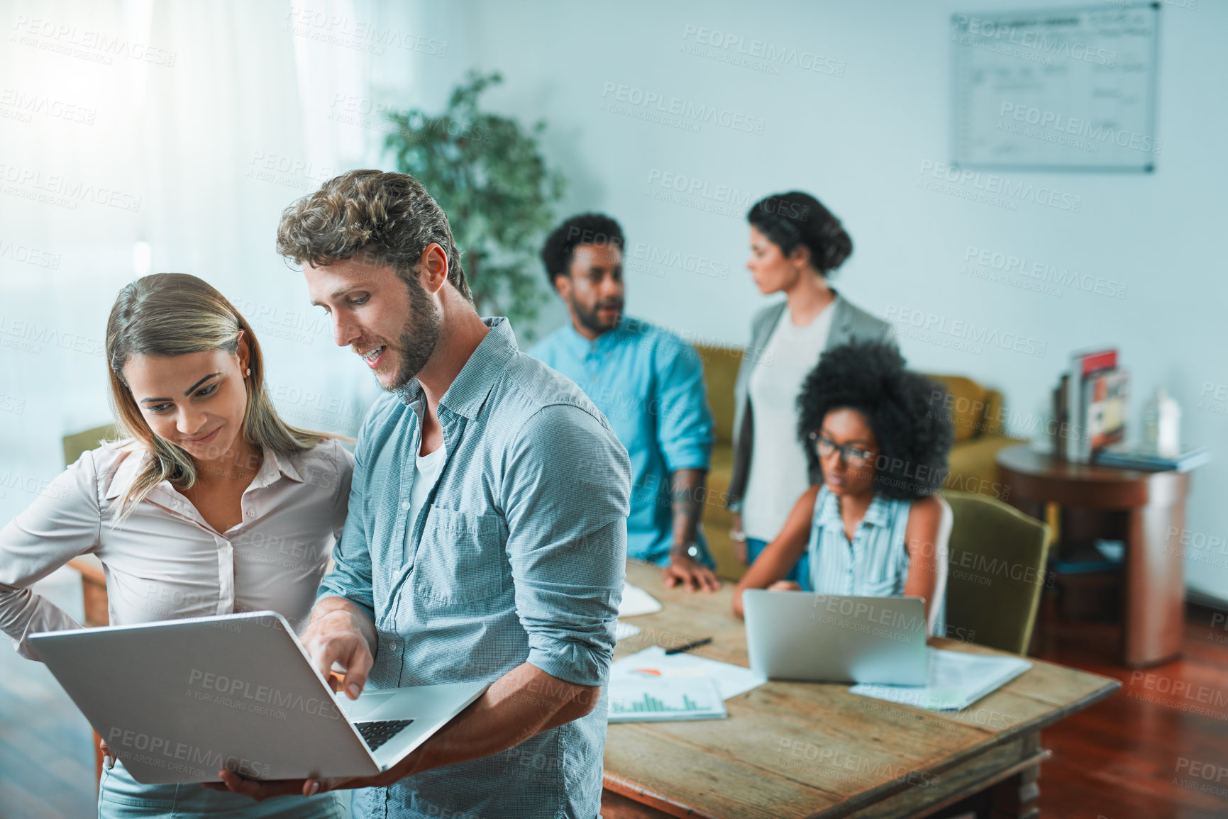 Buy stock photo Shot of young designers working in a modern office