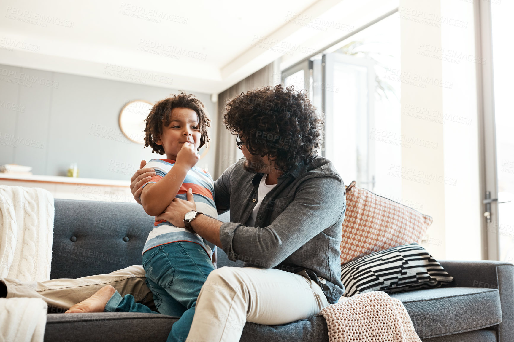 Buy stock photo House, playing and father on couch, son and bonding together for love, care and relax. Apartment, family and dad on sofa, games and happiness with weekend break, affection and childhood in lounge