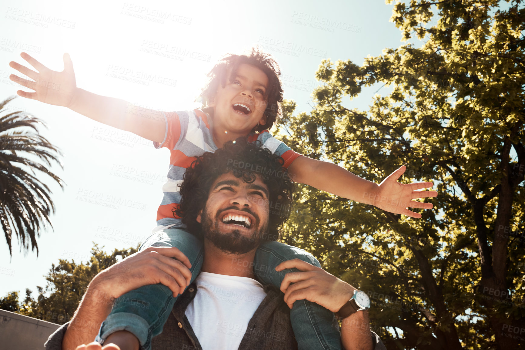 Buy stock photo Happy father, son and love with piggyback at backyard on holiday, freedom or bonding together at home. Dad with young child, kid or little boy on shoulder for fun flying or enjoying weekend in nature