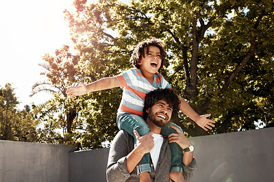 Buy stock photo Happy father, child and bonding or carry on shoulders at backyard for love, freedom or holiday together at home. Dad with son, kid or little boy for fun flying game or enjoying weekend in nature