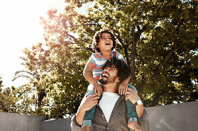 Buy stock photo Happy father, boy and love with piggyback at backyard on holiday, freedom or bonding together at home. Dad with young child, son or little kid with smile on shoulder for weekend in outdoor nature