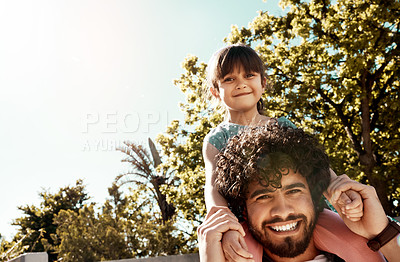 Buy stock photo Portrait of a father giving his little daughter a piggyback ride outdoors