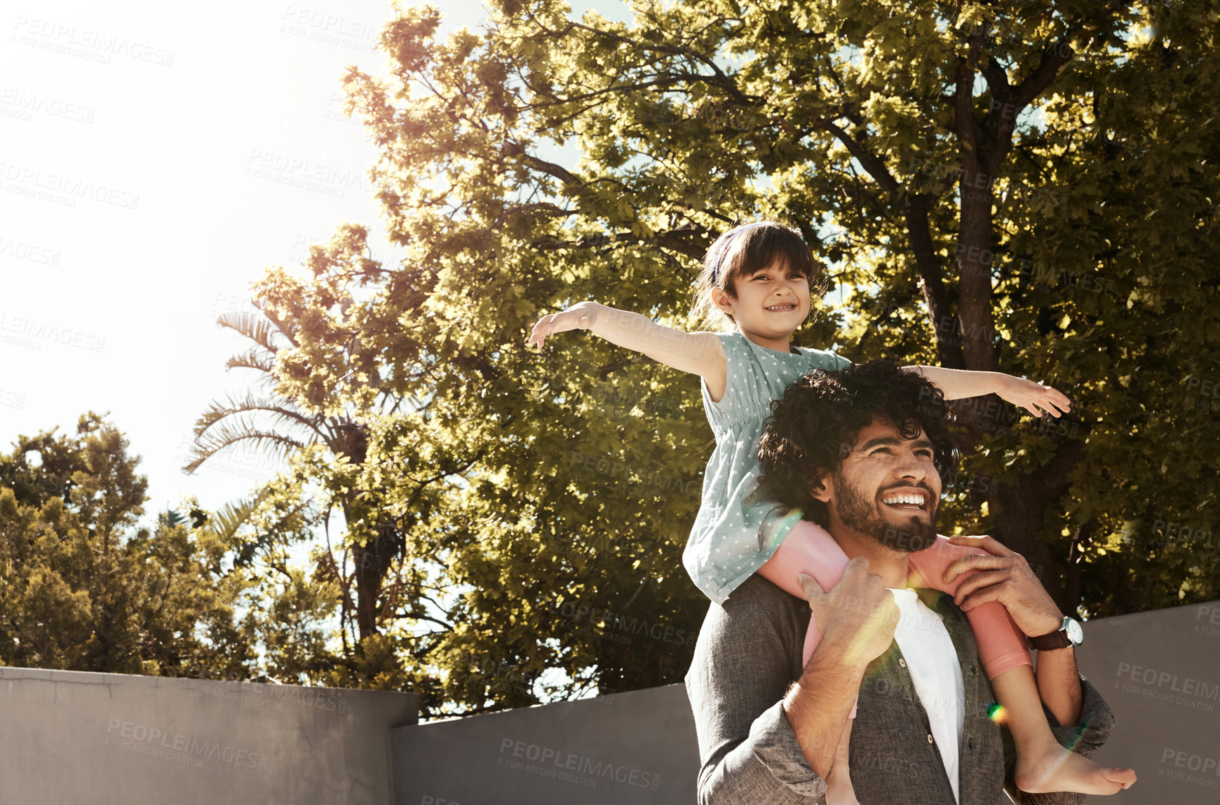 Buy stock photo Happy father, child and bonding with piggyback at backyard for love, freedom or holiday together at home. Dad with daughter, kid or little girl for shoulder, fun flying or enjoying weekend in nature