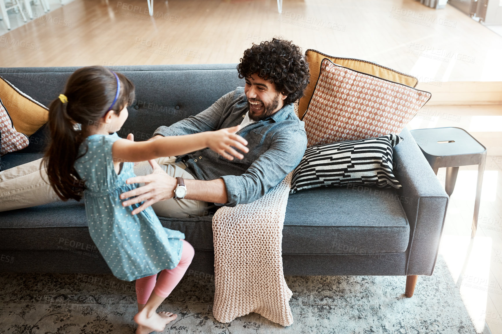 Buy stock photo Excited, dad and girl with hug on sofa for gratitude, care and bonding together in living room. Family, love and man with embrace of daughter at home for appreciation, trust or happiness in childhood