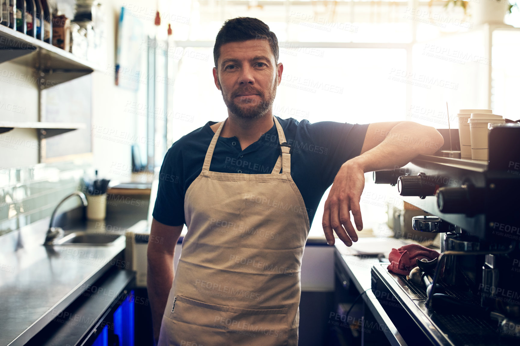 Buy stock photo Waiter, man and serious on portrait in cafe for customer service, hospitality and coffee shop startup. Small business, barista and server at counter with ready to welcome, bistro management or pride