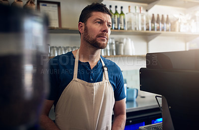 Buy stock photo Shot of a mature man working in a coffee shop