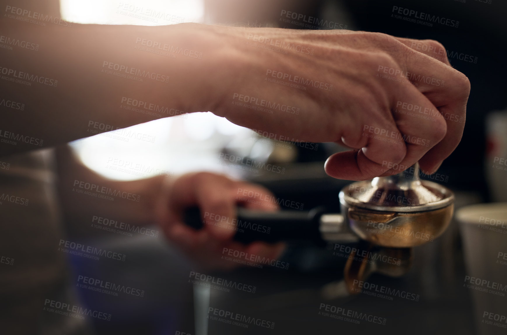 Buy stock photo Closeup shot of an unrecognizable barista operating a coffee machine in a cafe