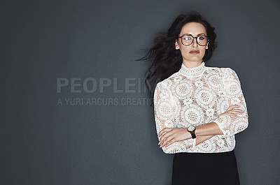 Buy stock photo Studio shot of a young attractive businesswoman posing against a grey background