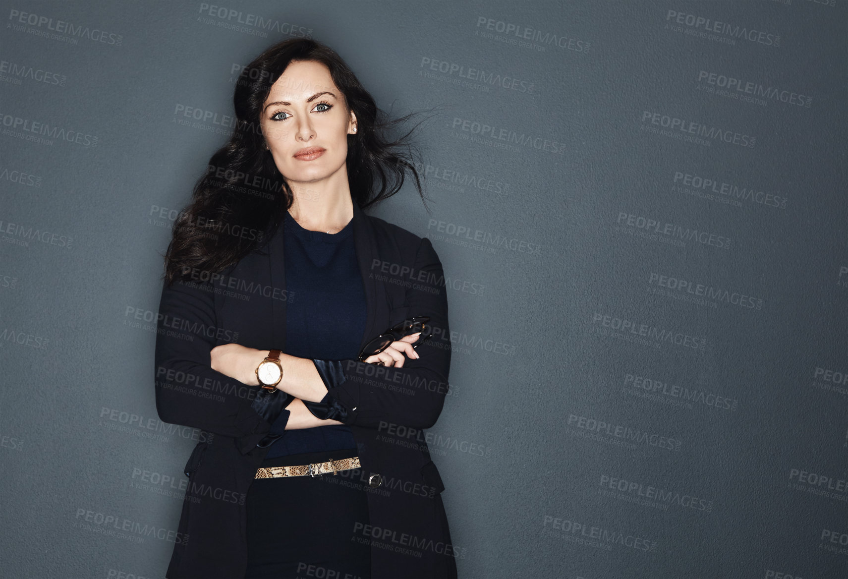 Buy stock photo Studio shot of a young attractive corporate businesswoman posing against a grey background