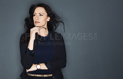 Buy stock photo Studio shot of a young attractive corporate businesswoman posing against a grey background