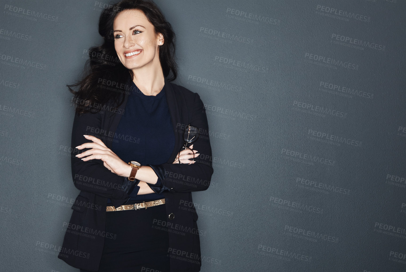 Buy stock photo Studio shot of a young attractive corporate businesswoman posing against a grey background