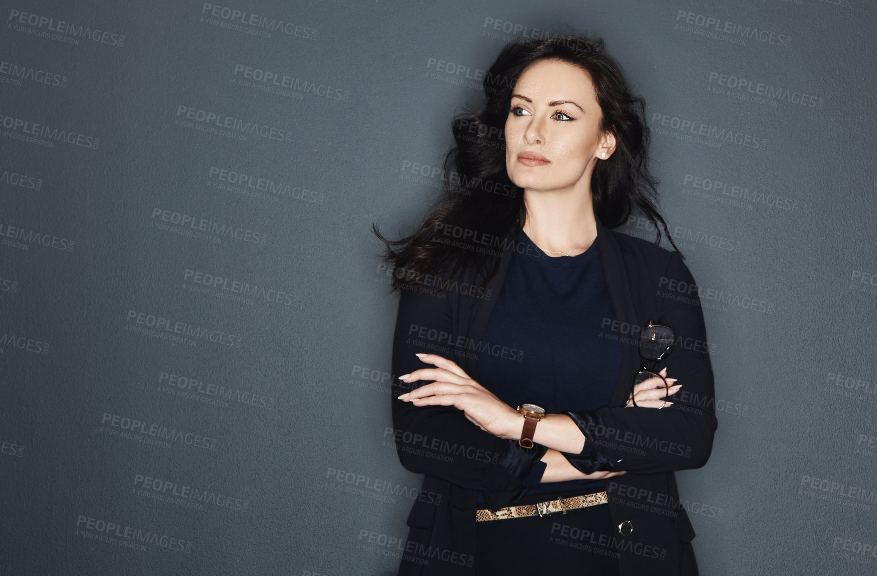 Buy stock photo Studio shot of a young attractive corporate businesswoman posing against a grey background