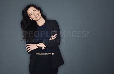 Buy stock photo Studio shot of a young attractive corporate businesswoman posing against a grey background