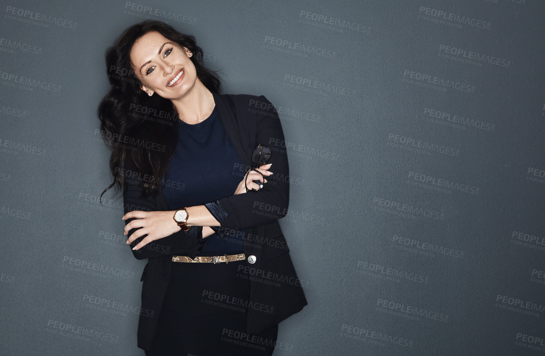 Buy stock photo Studio shot of a young attractive corporate businesswoman posing against a grey background