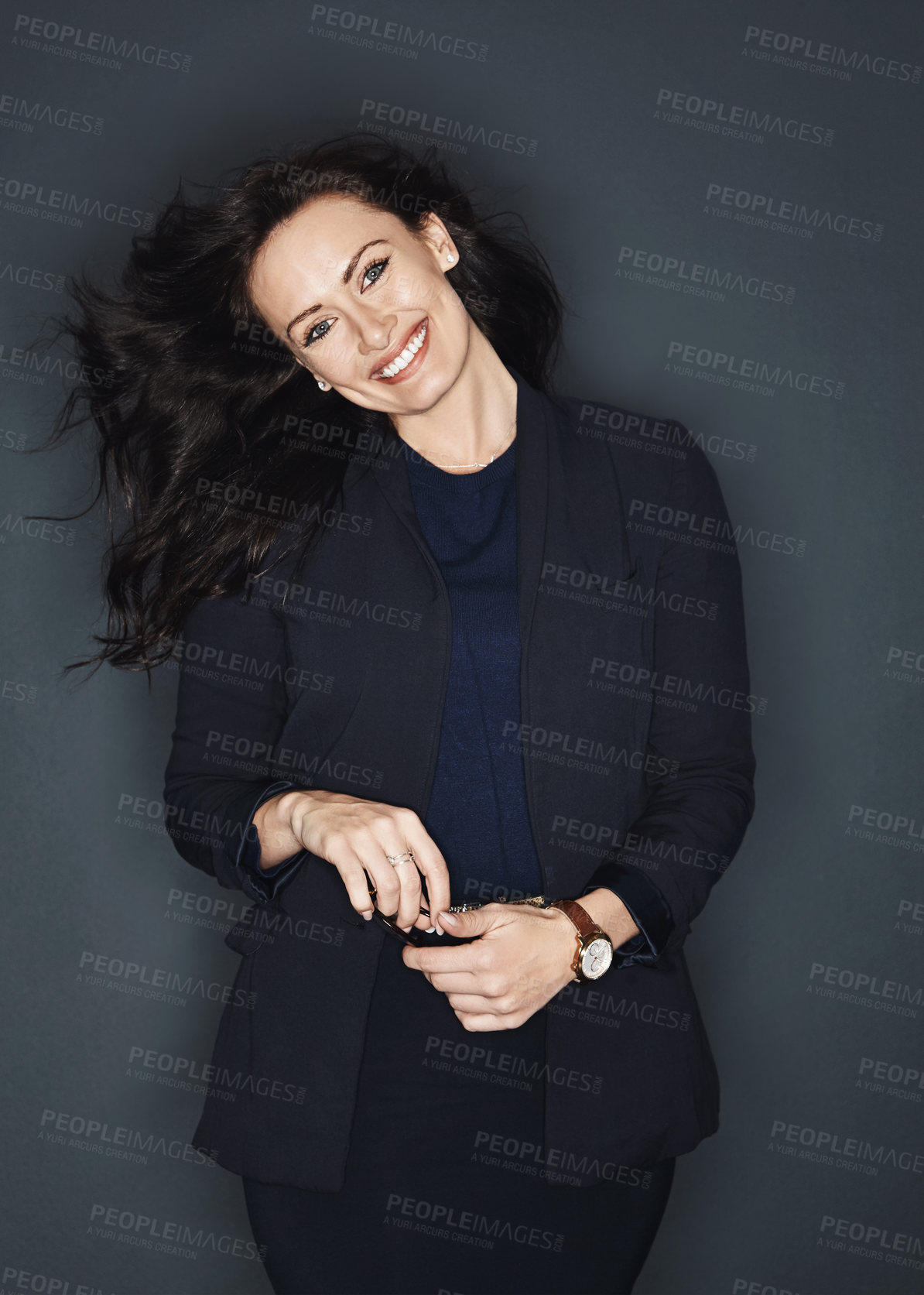 Buy stock photo Studio shot of a young attractive corporate businesswoman posing against a grey background