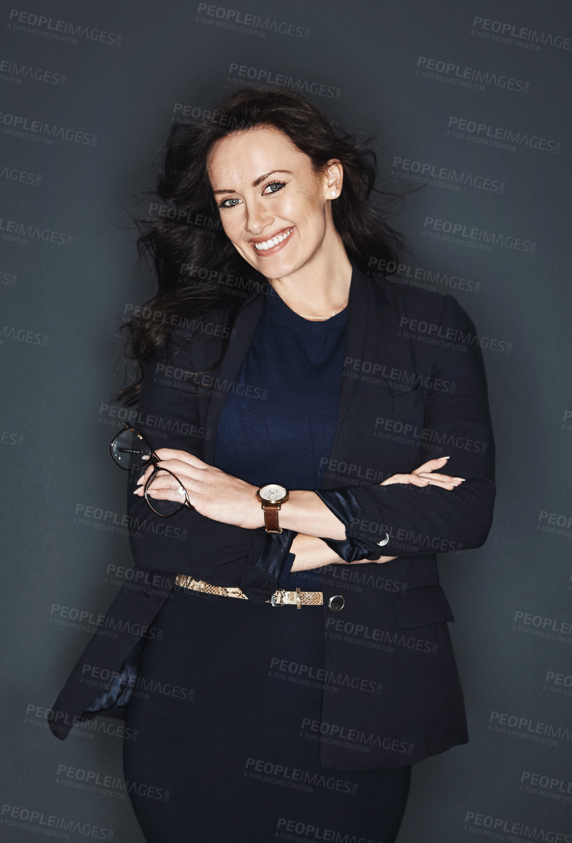 Buy stock photo Studio shot of a young attractive corporate businesswoman posing against a grey background